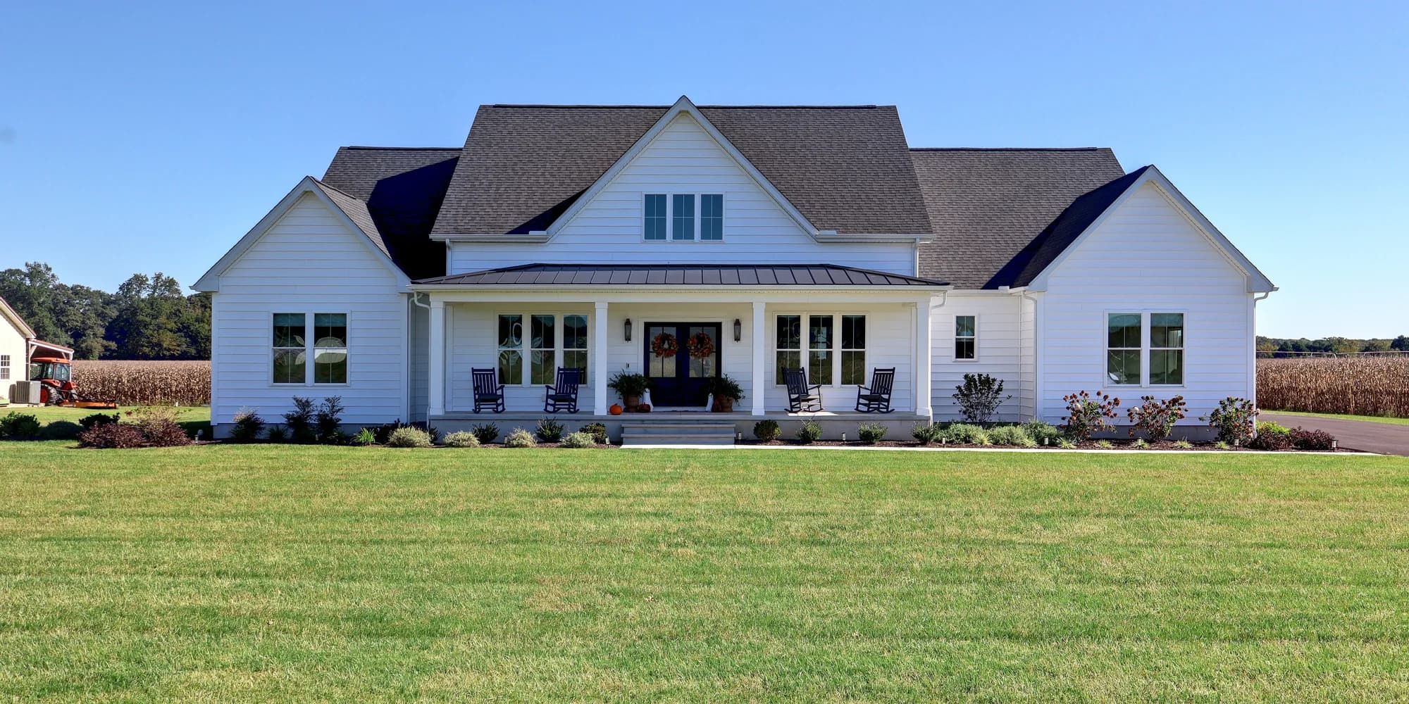 The front of the house in daylight under a clear blue sky